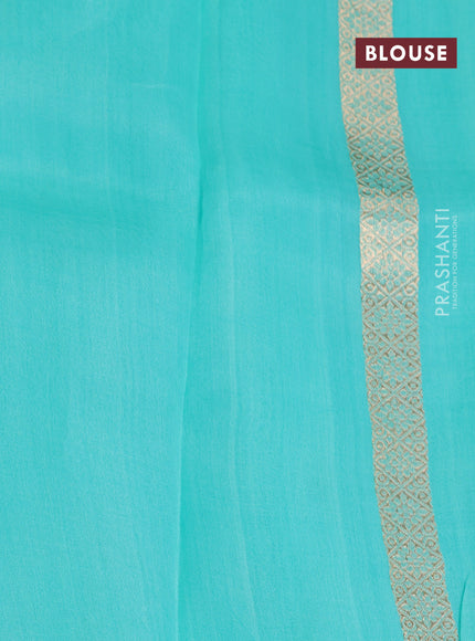 Banarasi organza saree teal shade with allover zari weaves and zari woven butta border