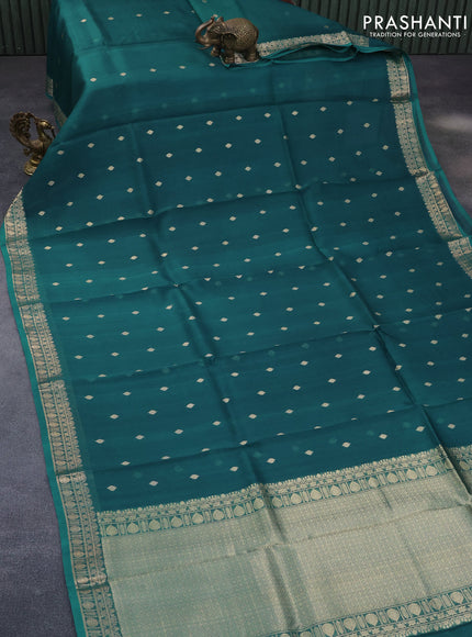 Banarasi organza saree peacock blue with zari woven buttas and zari woven border