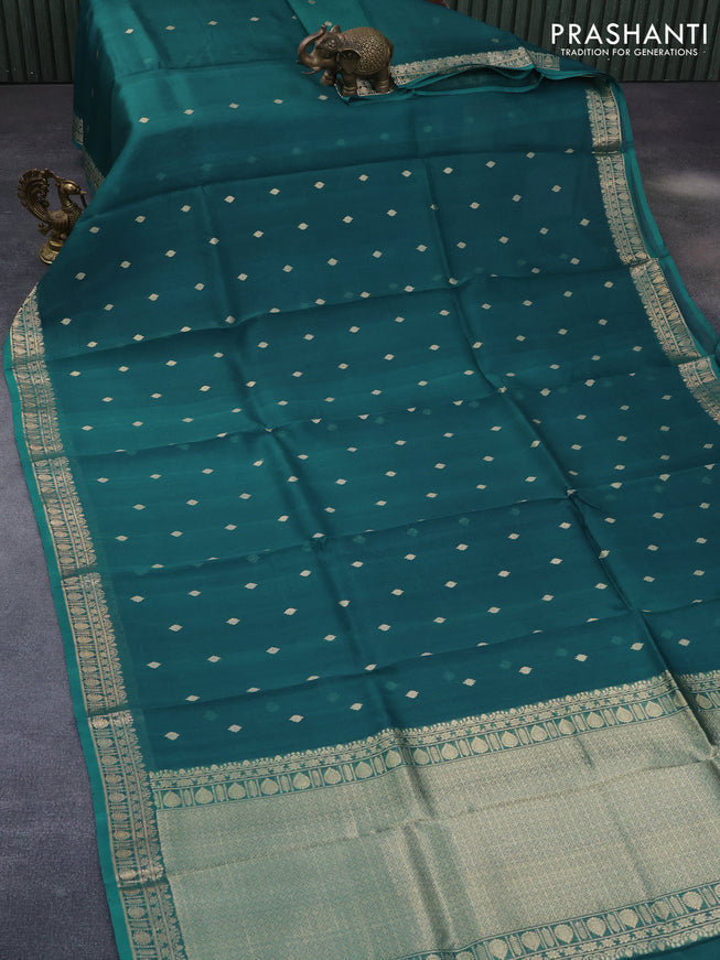 Banarasi organza saree peacock blue with zari woven buttas and zari woven border