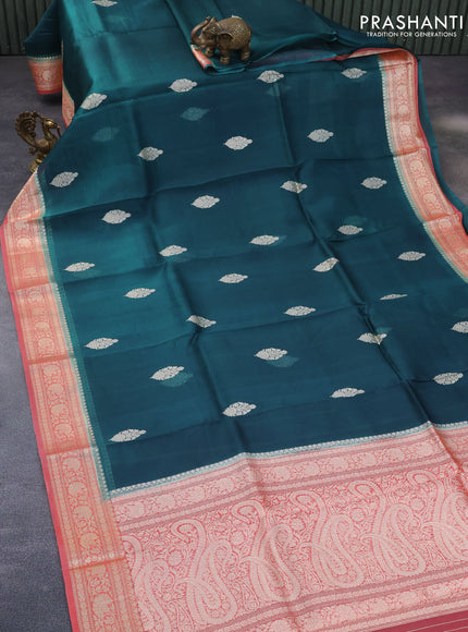 Banarasi organza saree peacock blue and peach orange with zari woven buttas and zari woven border