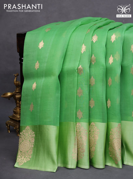 Banarasi organza saree light green with zari woven buttas and zari woven butta border