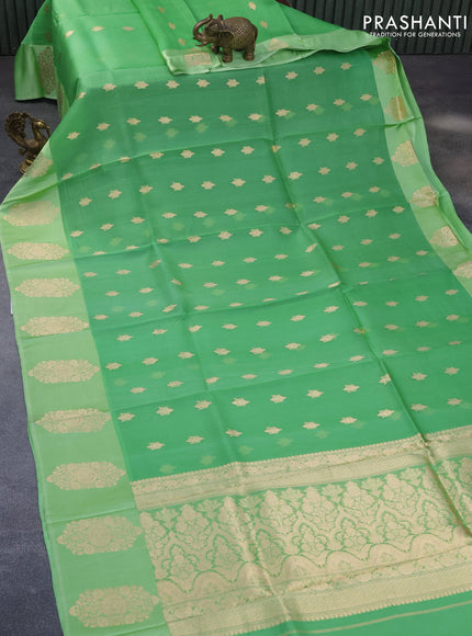 Banarasi organza saree light green with zari woven buttas and zari woven butta border