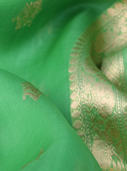 Banarasi organza saree light green with zari woven buttas and zari woven butta border