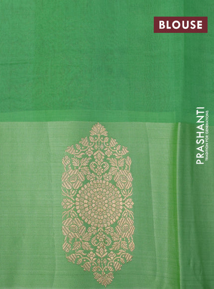 Banarasi organza saree light green with zari woven buttas and zari woven butta border