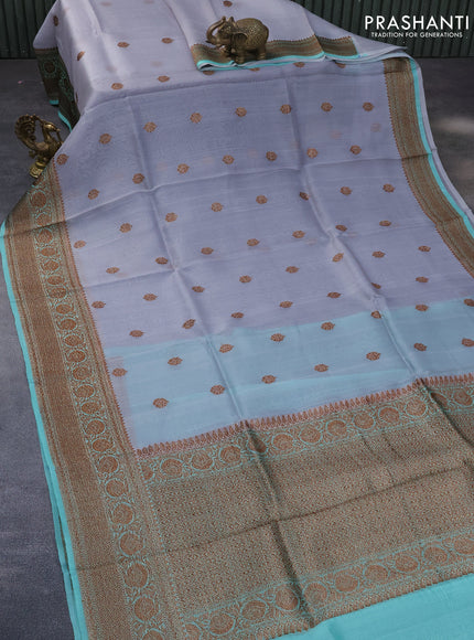 Banarasi organza saree grey shade and teal blue shade with woven buttas and banarasi style border