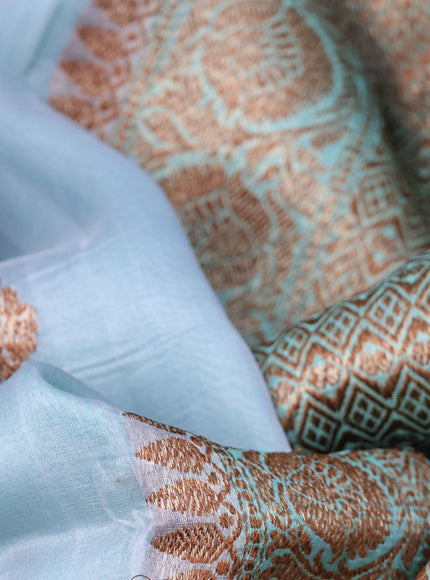 Banarasi organza saree grey shade and teal blue shade with woven buttas and banarasi style border