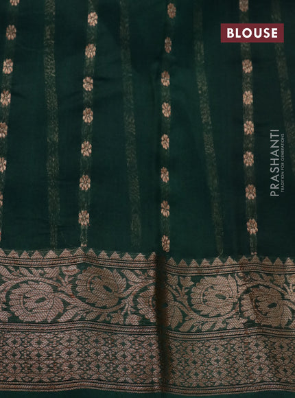 Banarasi organza saree dark green with woven buttas and banarasi style border