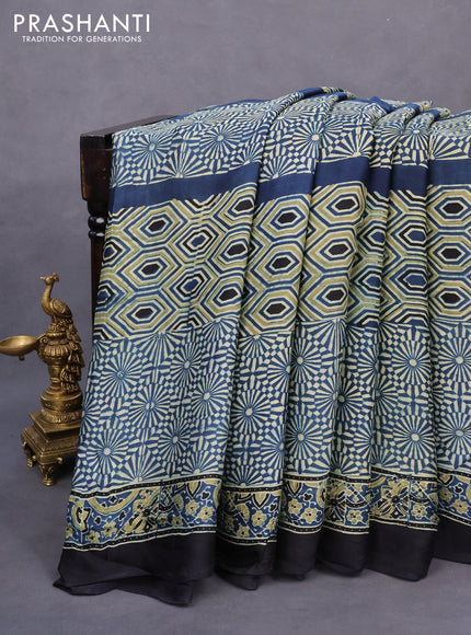 Modal silk saree peacock blue and black with allover ajrakh prints and printed border