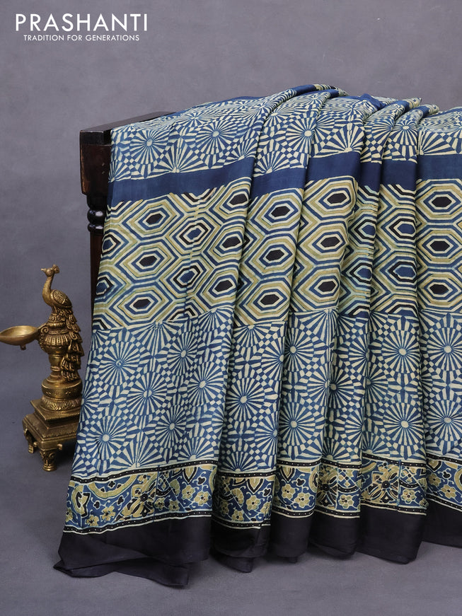 Modal silk saree peacock blue and black with allover ajrakh prints and printed border