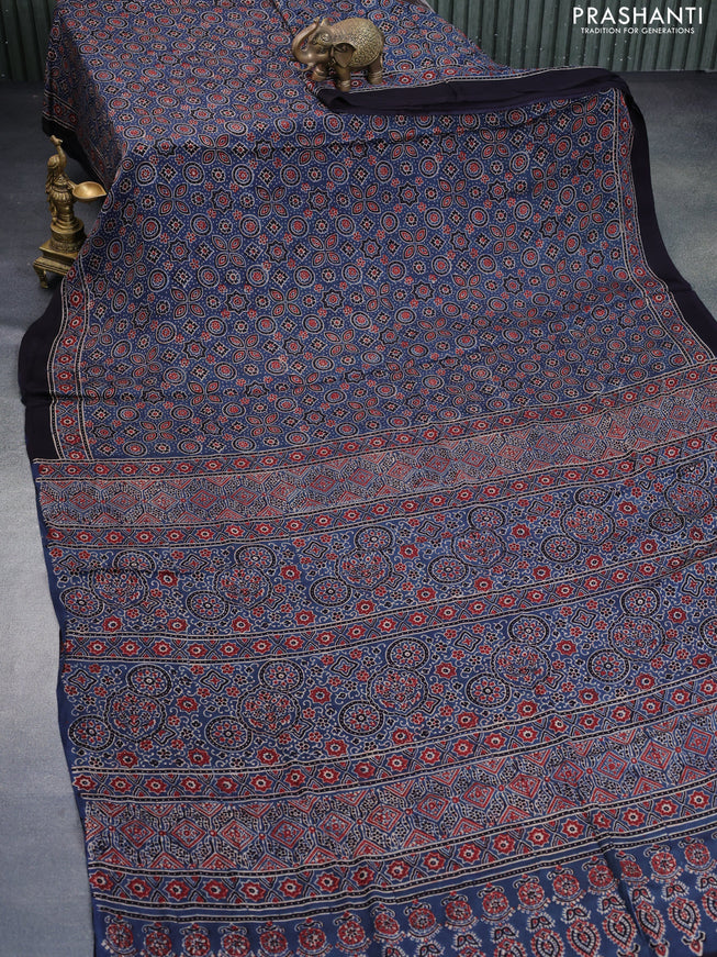 Modal silk saree peacock blue and black with allover ajrakh prints and printed border