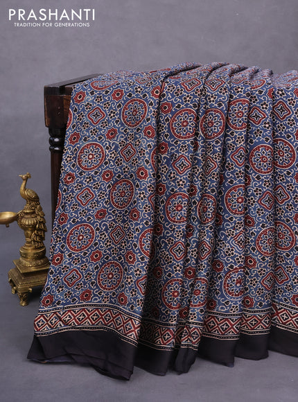 Modal silk saree peacock blue and black with allover ajrakh prints and printed border