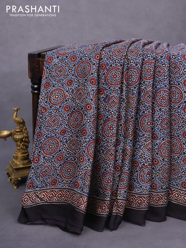 Modal silk saree peacock blue and black with allover ajrakh prints and printed border