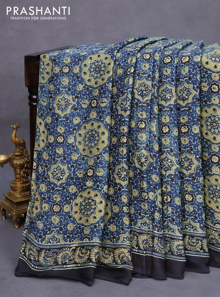 Modal silk saree peacock blue and black with allover ajrakh prints and printed border