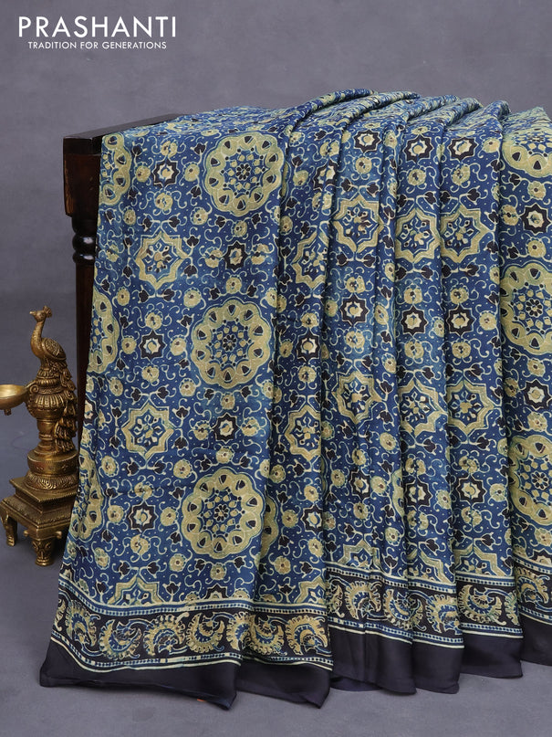 Modal silk saree peacock blue and black with allover ajrakh prints and printed border