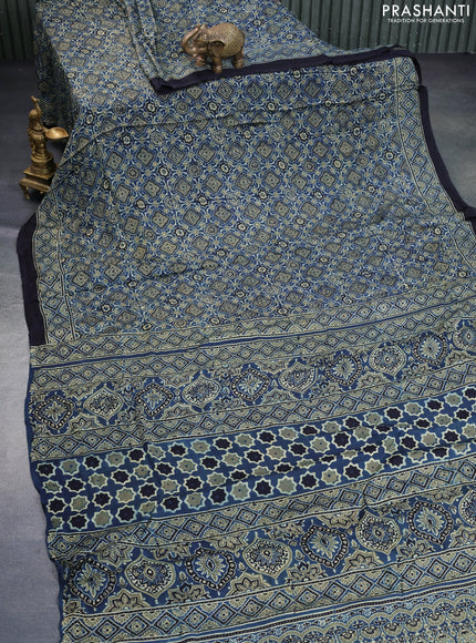 Modal silk saree peacock blue and black with allover ajrakh prints and printed border