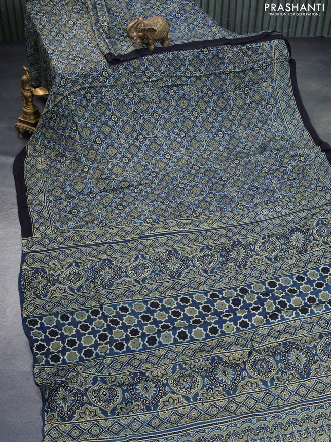 Modal silk saree peacock blue and black with allover ajrakh prints and printed border