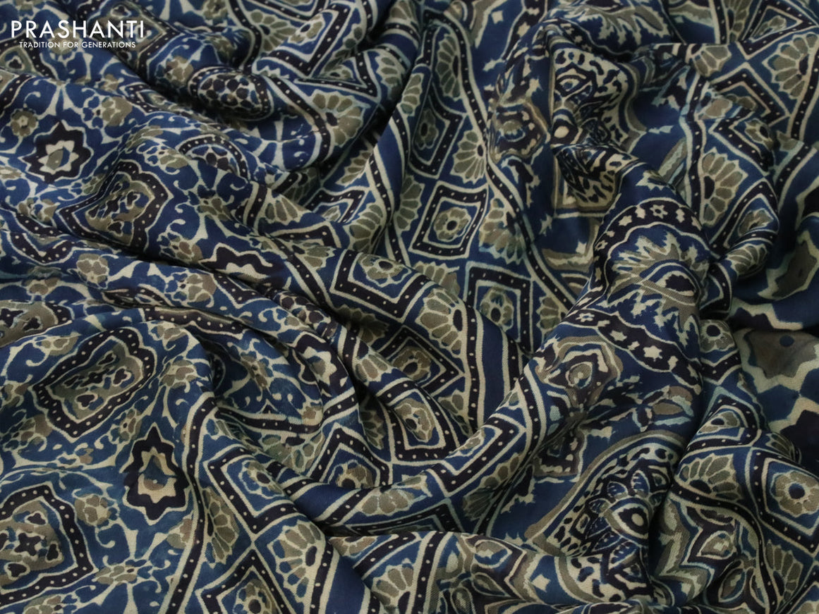 Modal silk saree peacock blue and black with allover ajrakh prints and printed border