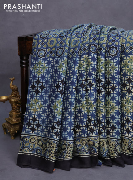 Modal silk saree peacock blue and black with allover ajrakh prints in borderless style