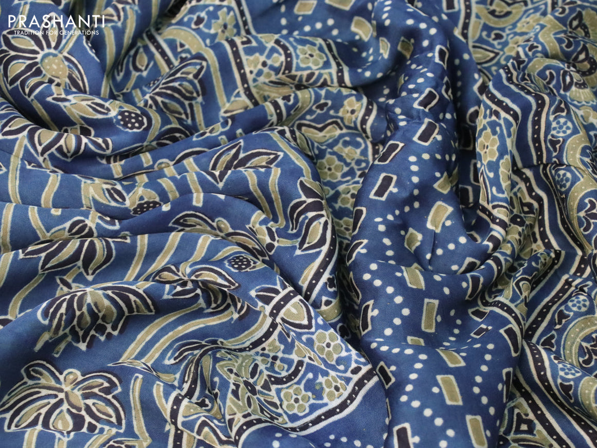 Modal silk saree peacock blue and black with allover ajrakh prints in borderless style