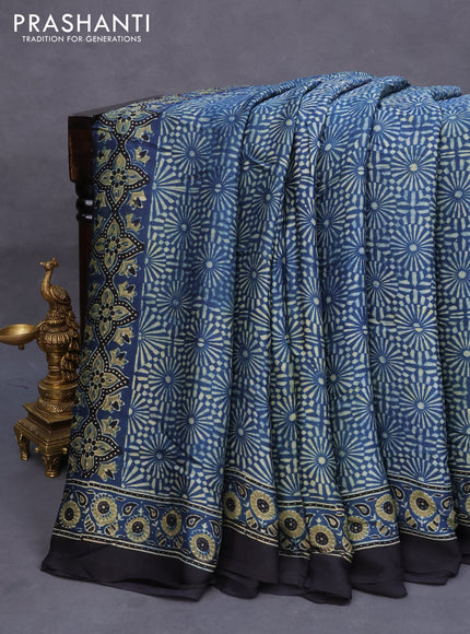 Modal silk saree peacock blue and black with allover ajrakh prints and printed border