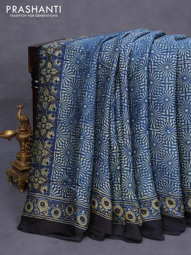 Modal silk saree peacock blue and black with allover ajrakh prints and printed border