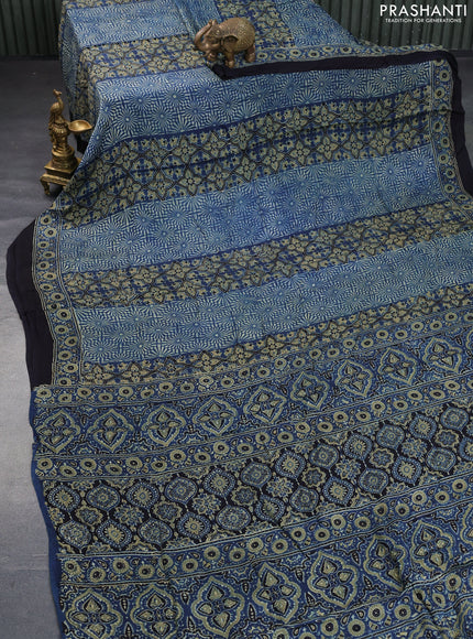 Modal silk saree peacock blue and black with allover ajrakh prints and printed border