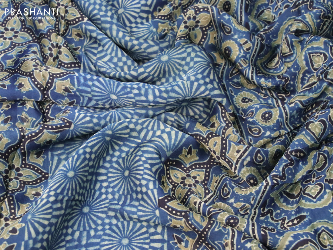 Modal silk saree peacock blue and black with allover ajrakh prints and printed border