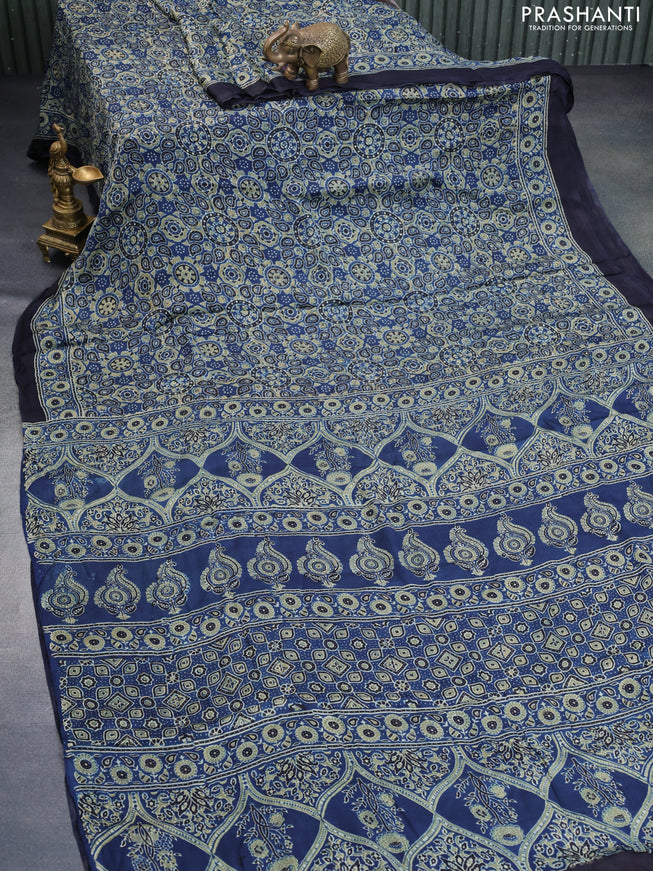 Modal silk saree peacock blue with allover ajrakh prints and printed border