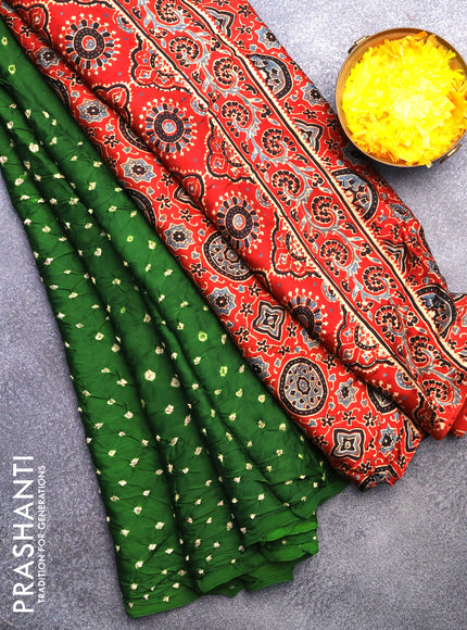 Modal silk saree green and rustic maroon with allover bandhani prints and ajrakh printed pallu