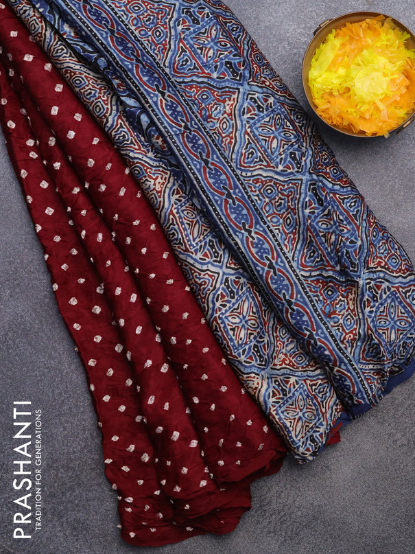 Modal silk saree deep maroon and indigo blue with allover bandhani prints and ajrakh printed pallu