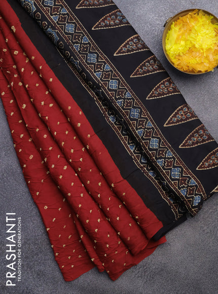 Modal silk saree red and black with allover bandhani prints and ajrakh printed pallu