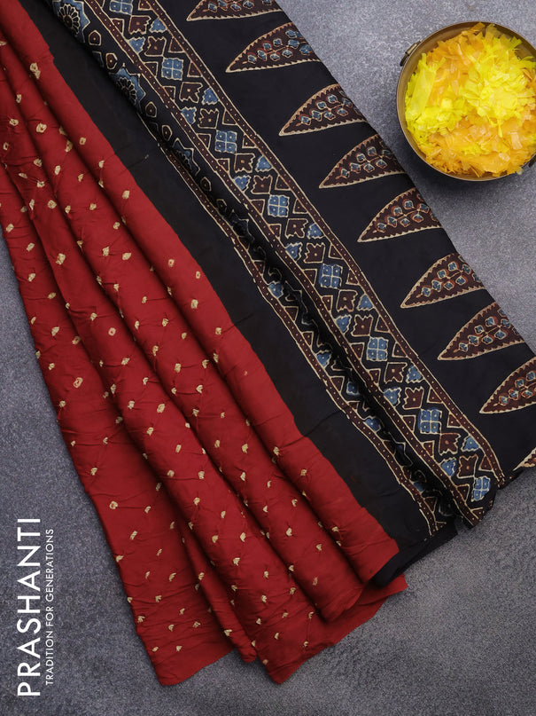 Modal silk saree red and black with allover bandhani prints and ajrakh printed pallu