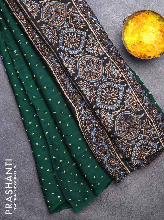 Modal silk saree green and black with allover bandhani prints and ajrakh printed pallu