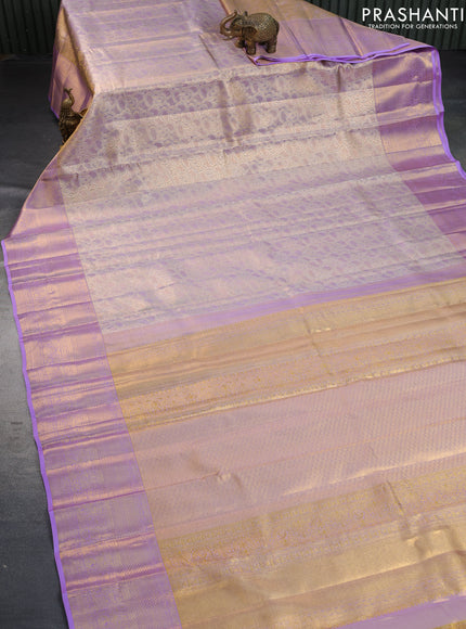 Pure kanchipuram tissue silk saree dual shade of gold and lavender shade with allover silver zari woven brocade weaves and long zari woven border