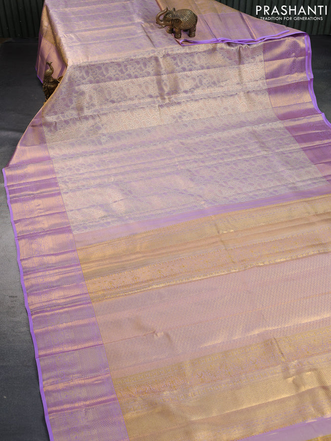 Pure kanchipuram tissue silk saree dual shade of gold and lavender shade with allover silver zari woven brocade weaves and long zari woven border