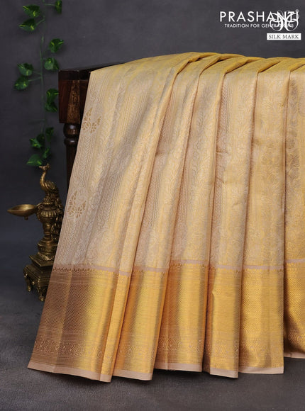 Pure kanchipuram tissue silk saree dual shade of gold and beige with allover zari woven brocade weaves and zari woven border