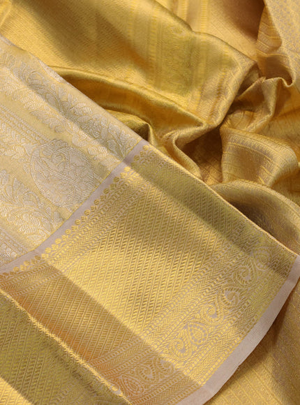 Pure kanchipuram tissue silk saree dual shade of gold and beige with allover zari woven brocade weaves and zari woven border