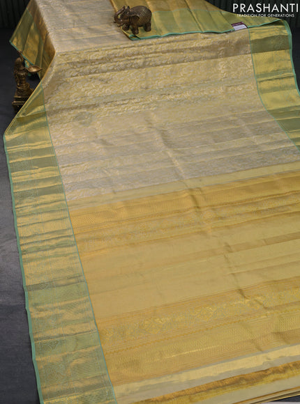 Pure kanchipuram tissue silk saree gold and pastel green with allover silver zari woven brocade weaves and rich zari woven border