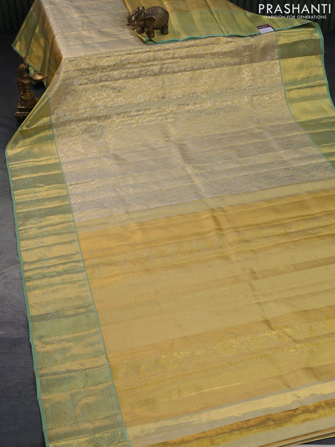 Pure kanchipuram tissue silk saree gold and pastel green with allover silver zari woven brocade weaves and rich zari woven border