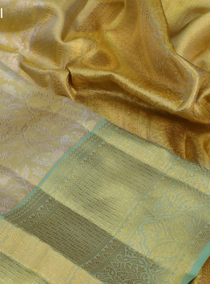 Pure kanchipuram tissue silk saree gold and pastel green with allover silver zari woven brocade weaves and rich zari woven border