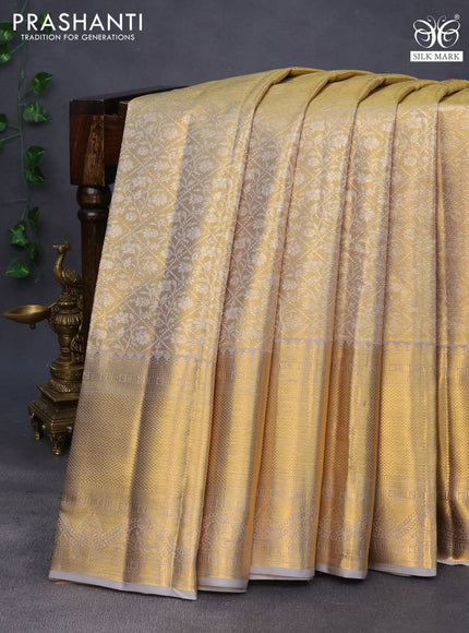 Pure kanchipuram tissue silk saree gold and grey with allover silver zari woven brocade weaves and long rich zari woven border