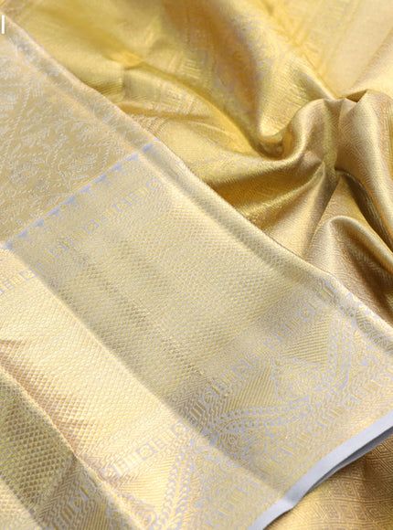 Pure kanchipuram tissue silk saree gold and grey with allover silver zari woven brocade weaves and long rich zari woven border