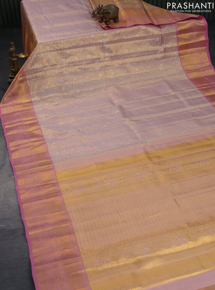 Pure kanchipuram tissue silk saree pastel peach and peach pink with allover silver zari woven brocade weaves and long rich zari woven border