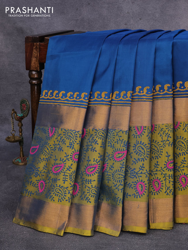 Pure uppada block printed saree peacock blue and dual shade of yellowish blue with plain body and long zari woven printed border