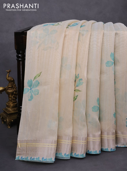 Semi tussar saree cream and teal blue with allover floral digital prints and zari woven border