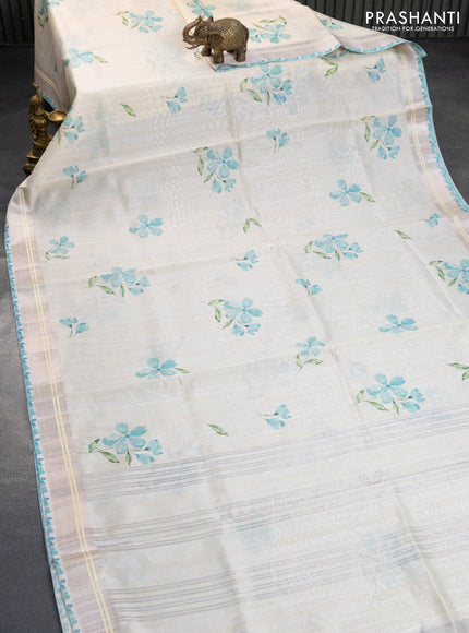 Semi tussar saree cream and teal blue with allover floral digital prints and zari woven border