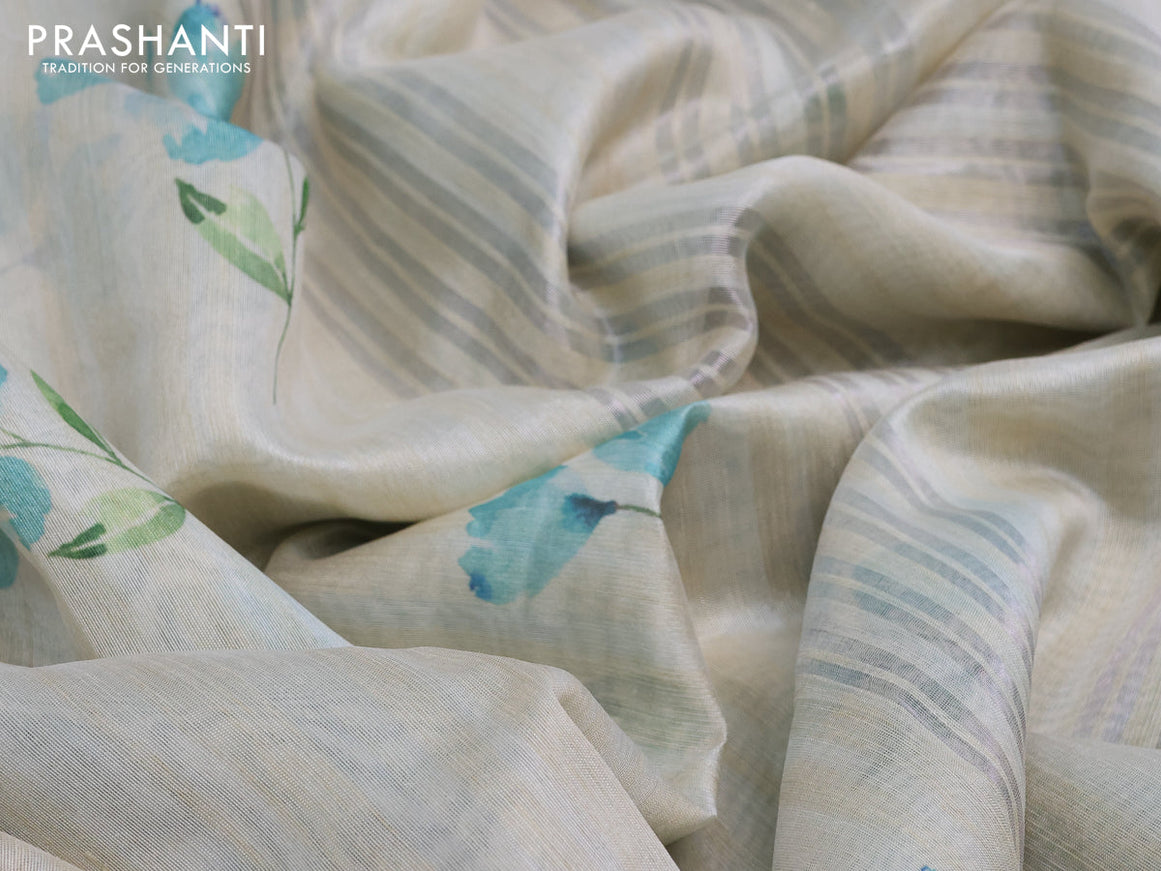 Semi tussar saree cream and teal blue with allover floral digital prints and zari woven border