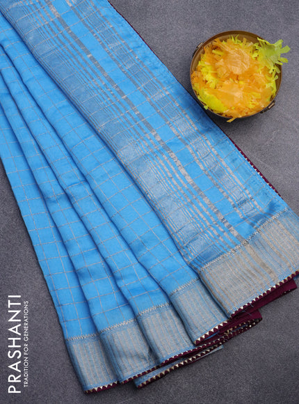 Semi chanderi saree light blue and purple with allover zari checks and zari woven & gotapatti lace work border