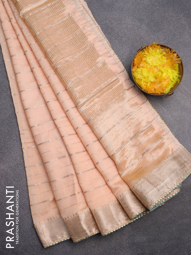 Semi chanderi saree sandal and pastel green with allover zari woven stripes pattern and zari woven & gotapatti lace work border