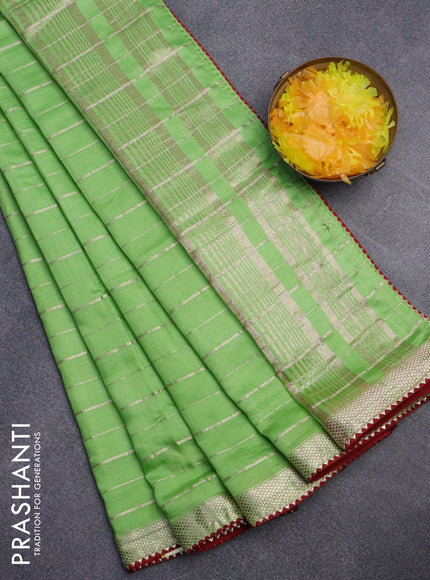 Semi chanderi saree light green and red with allover zari woven stripes pattern and zari woven & gotapatti lace work border